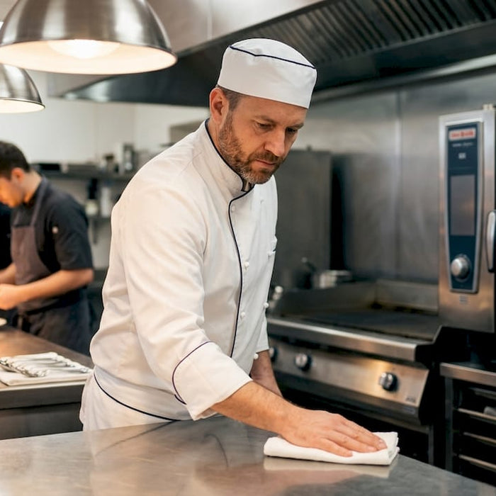 Chef working with high-volume kitchen appliances