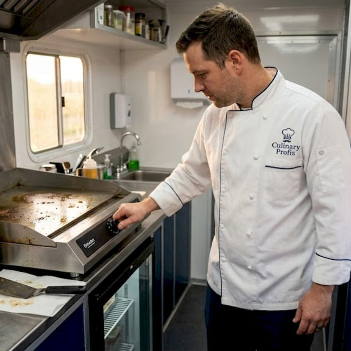 Chef checks portable cooking equipment in food truck