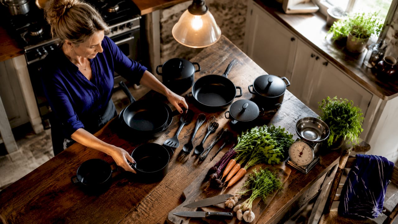 Professional cookware and tools arranged on kitchen counter