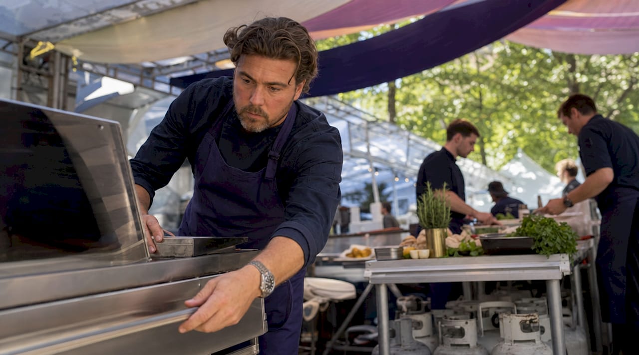 Chef preparing outdoor catering kitchen setup