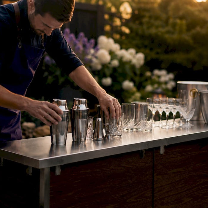 Bartender setting up portable bar outdoors