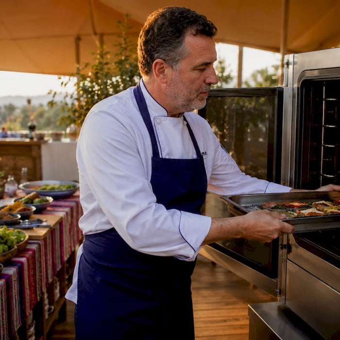 Chef using rapid cook oven in kitchen