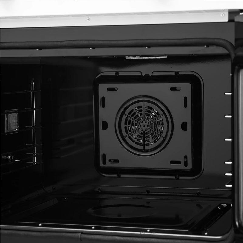 Black oven cavity close-up of round rear fan and mounting plate