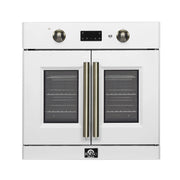 White single wall oven front with two brass vertical handles and dark window
